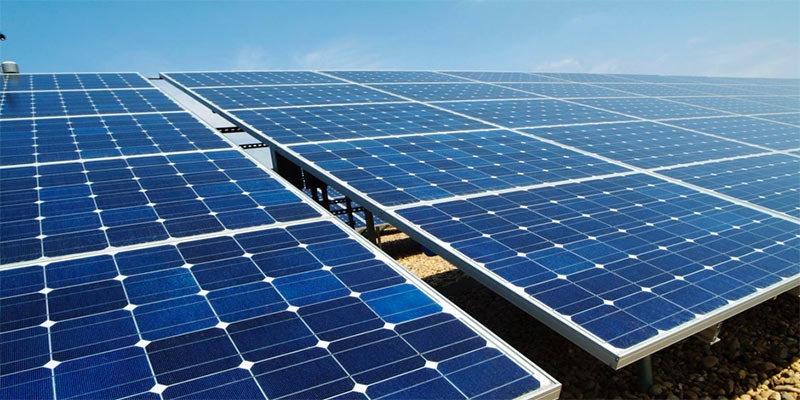 ground mount solar panels with blue sky background