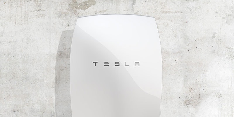 home improvement scheme option of white tesla powerwall battery mounted on concrete wall