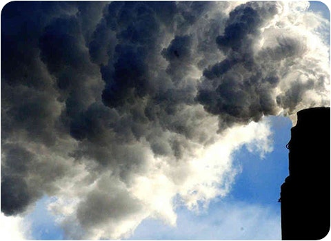 pollution pouring out of chimney into atmosphere