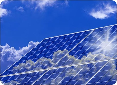 six solar panels joined together with reflection of sun and clouds on them