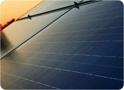 close up showing 4 solar panels at sunset